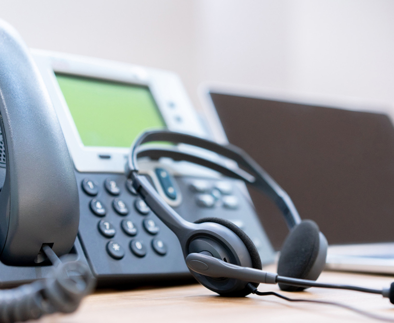close-up-soft-focus-headset-with-telephone-devices-office-desk-customer-service-support